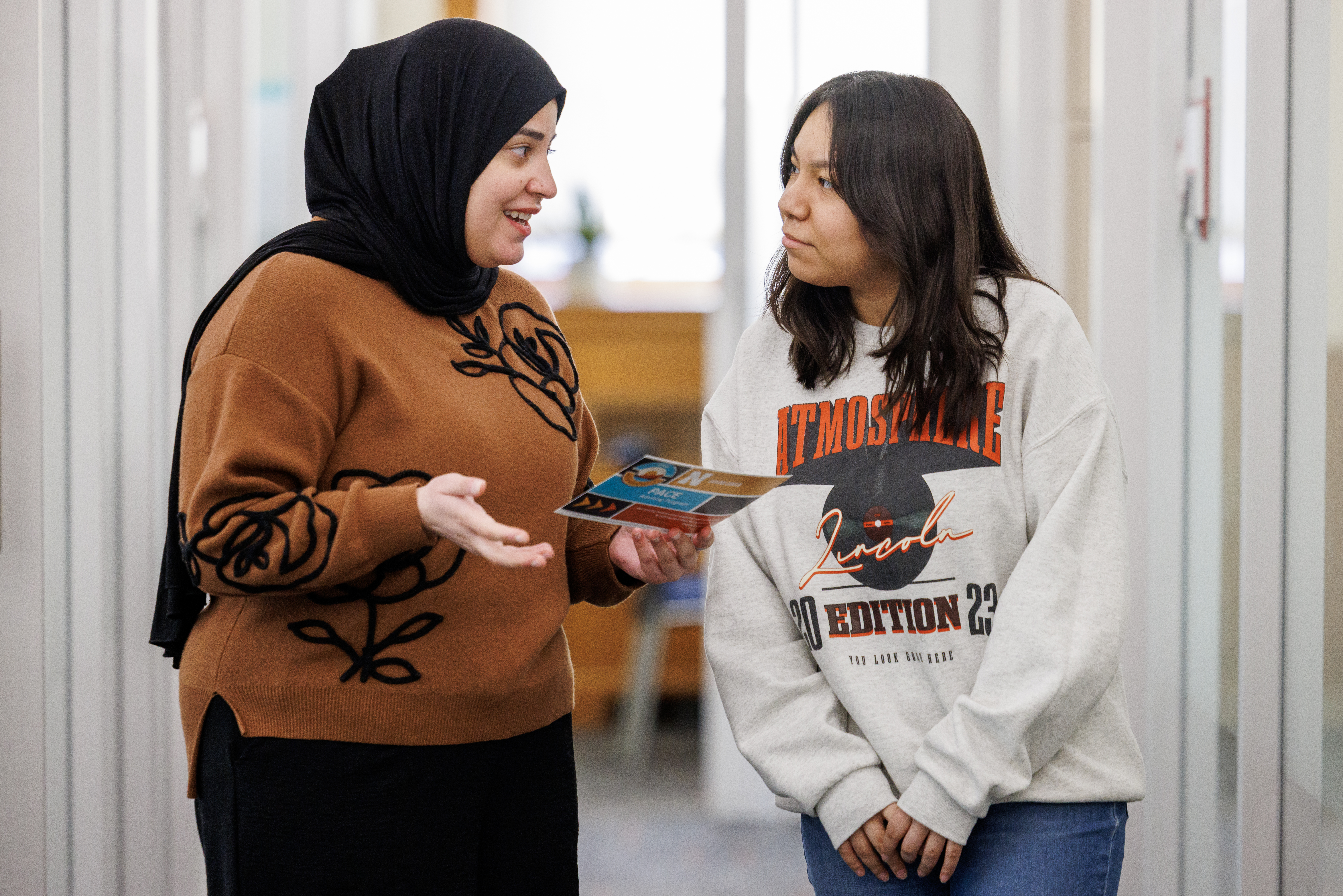 advisor talking with student